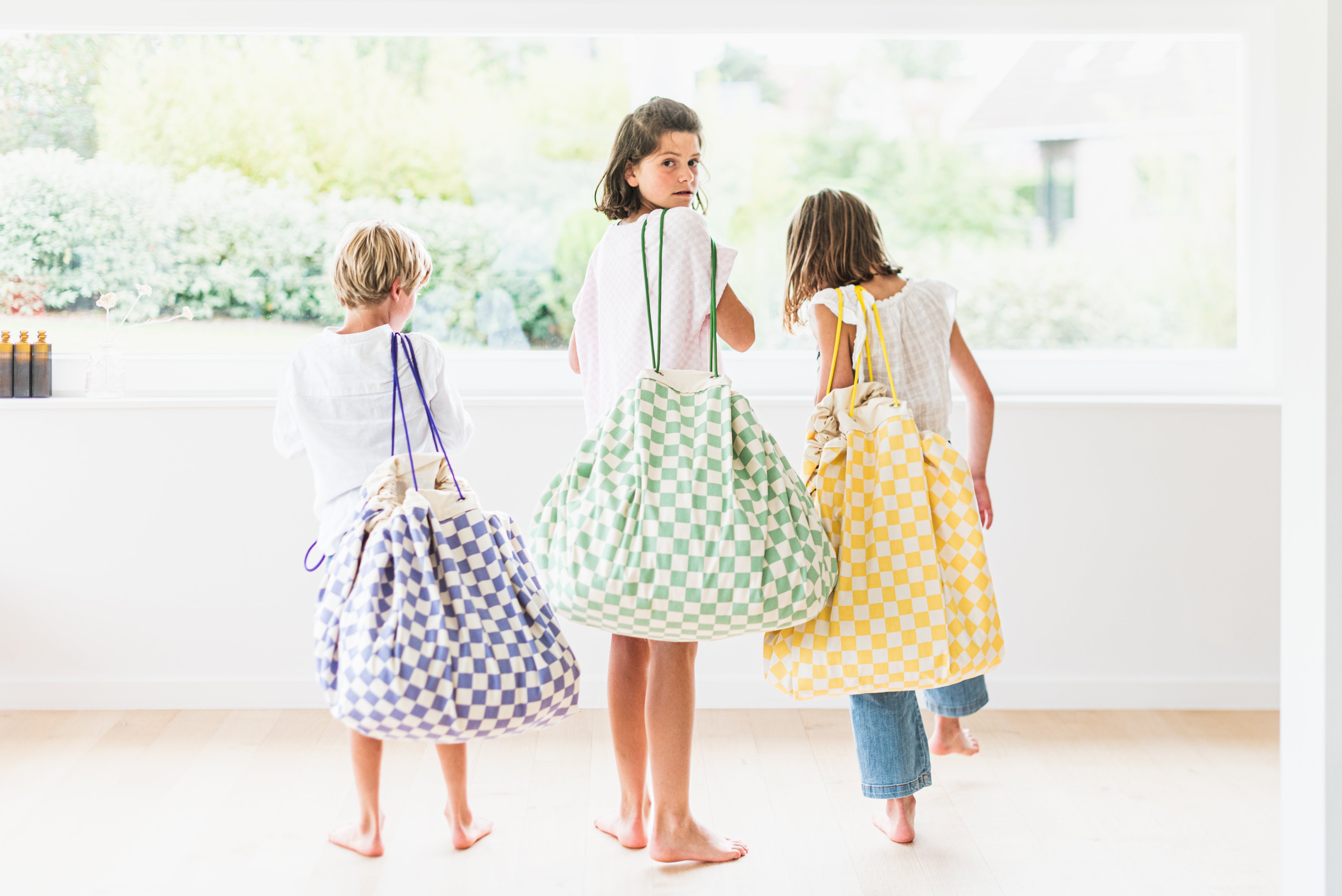 vichy storage bags, children carrying the bags in different colors