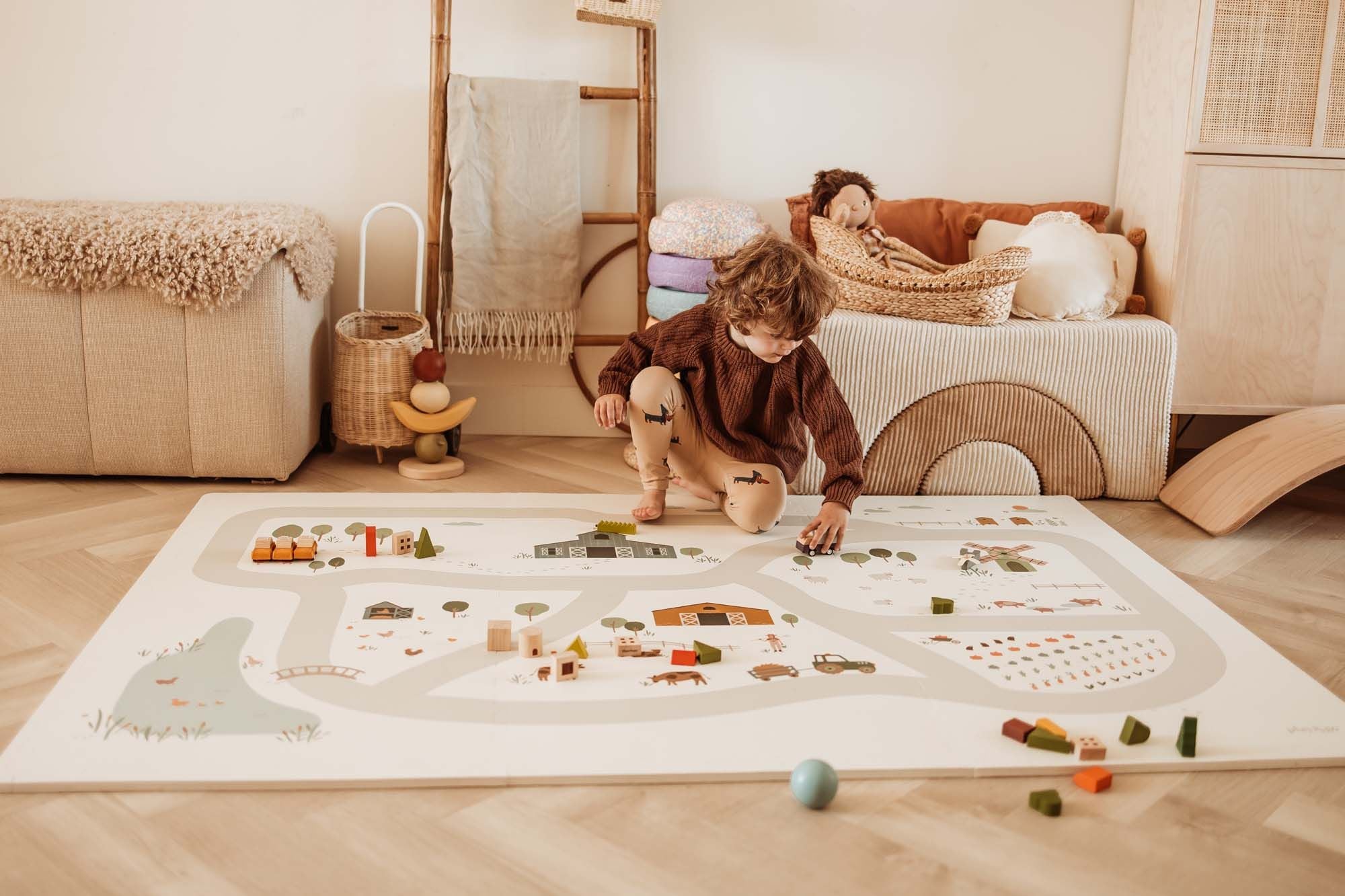 EEVAA farm puzzlemat, child is playing on the mat in kidsroom, wooden toys and baskets, a wooden slide