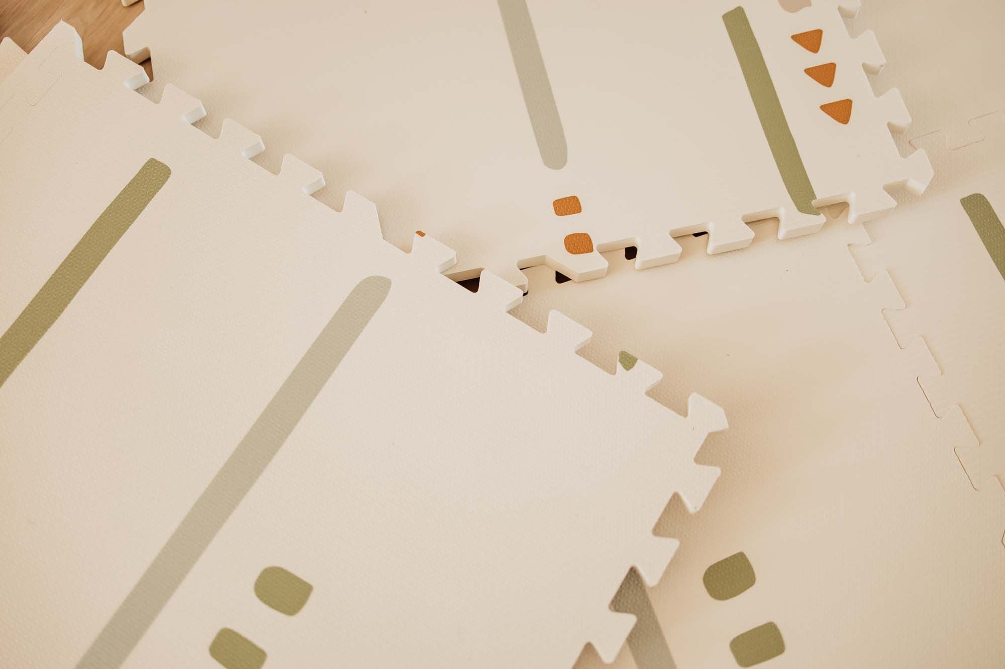 detail of EEVAA farm puzzlemat, back side print stripes and icons