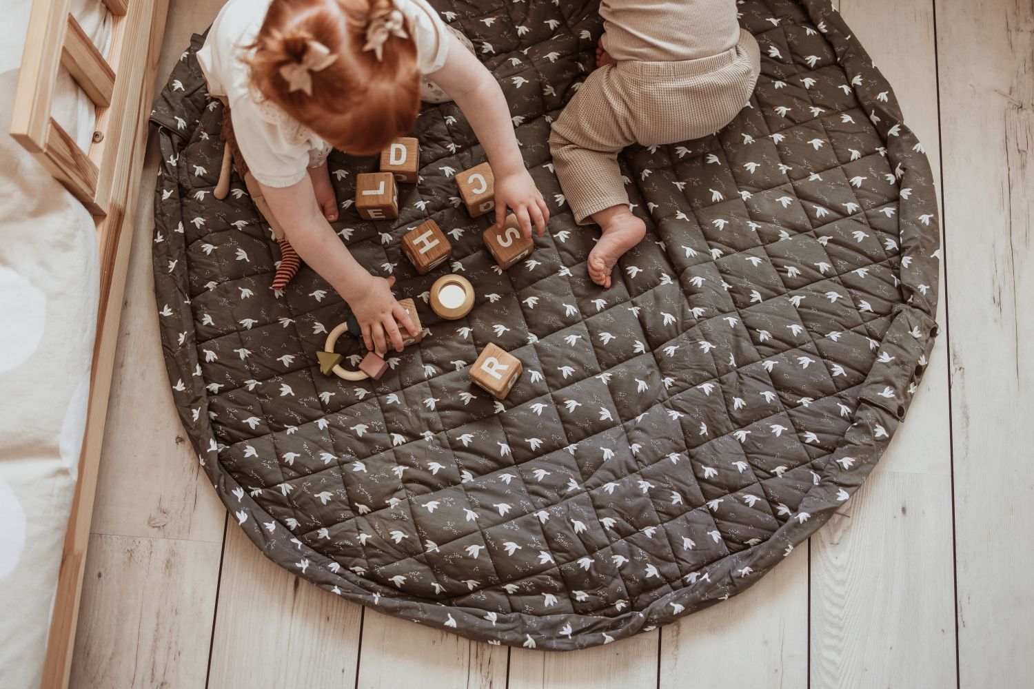 birds soft organic babymat, children are playing on the mat with wooden blocks