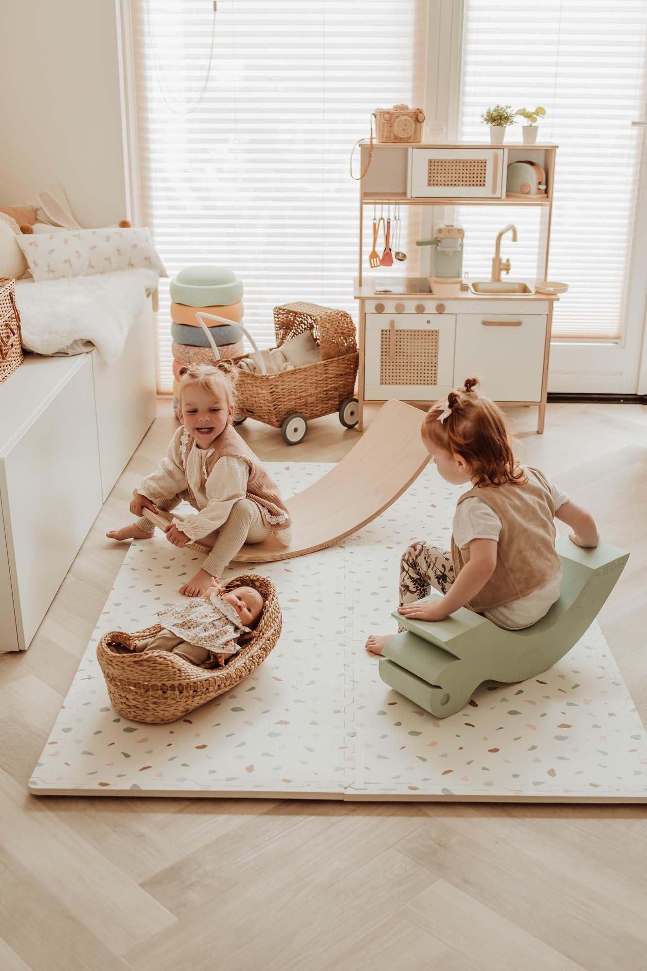 EEVAA village/terrazzo foam puzzle mat, children playing on slides on the mat on floor in cosy kidsroom