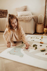 EEVAA farm puzzlemat, child is playing with wooden cars on the mat, wooden basket and sofa in the room
