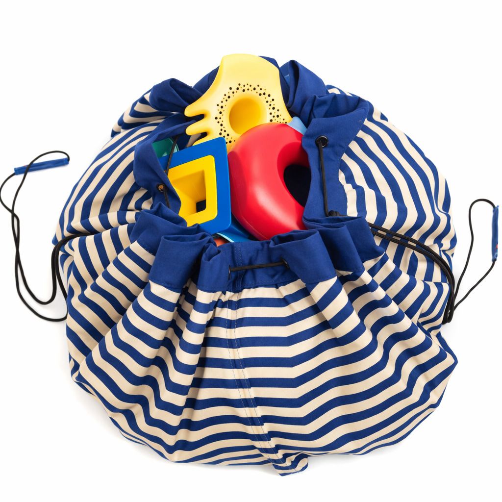 Beach outdoor storage bag, blue and white striped drawstring bag filled with colorful toys 