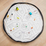 toy storage bag, open mat, road side, wooden cars