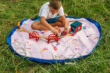 Beach outdoor storage bag, child is playing on the mat with wooden toy construction