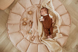 bloom stripes brown babymat, open, baby is lying on the mat, looking at wooden toys