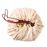 detail picture of cherry cherry toy storage bag, closed, filled with lego