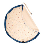 detail of magical days outdoor beach bag, open with folded piece, shoulderstrap