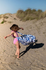 Pirate outdoor storage bag, child is carrying the bag around its body while turning around