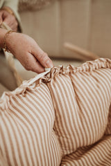 bloom stripes brown babymat, crib, raised edges, detail of closure system