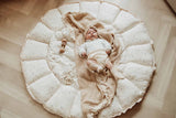 Bloom moon organic babymat, open on floor, baby sleeping on blanket on the mat