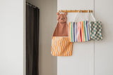 toto bear, hanging on coat rack on wall, toto unicorn and toto dino transformed into a bag