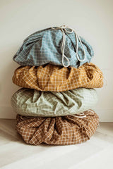 pyramid of grid blue, mustard, green and brown organic storage bags