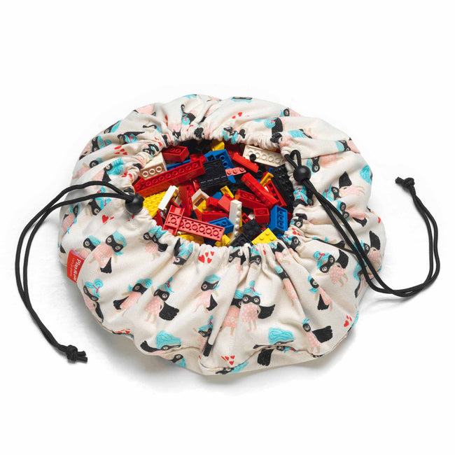 supergirl mini toy storage bag, filled with lego