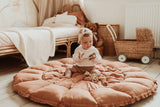 Bloom tawny brown organic babymat, open on floor, child sitting on mat playing, kidsroom, bed and baby carriage