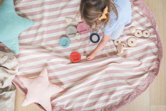 Stripes Pink New toy storage bag, child playing with wooden toys, mat open on floor
