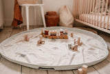 storage bag, jungle print, open of floor in kidsroom, lots of wooden toys and wooden train