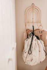 jungle storage bag, hanging on coat rack