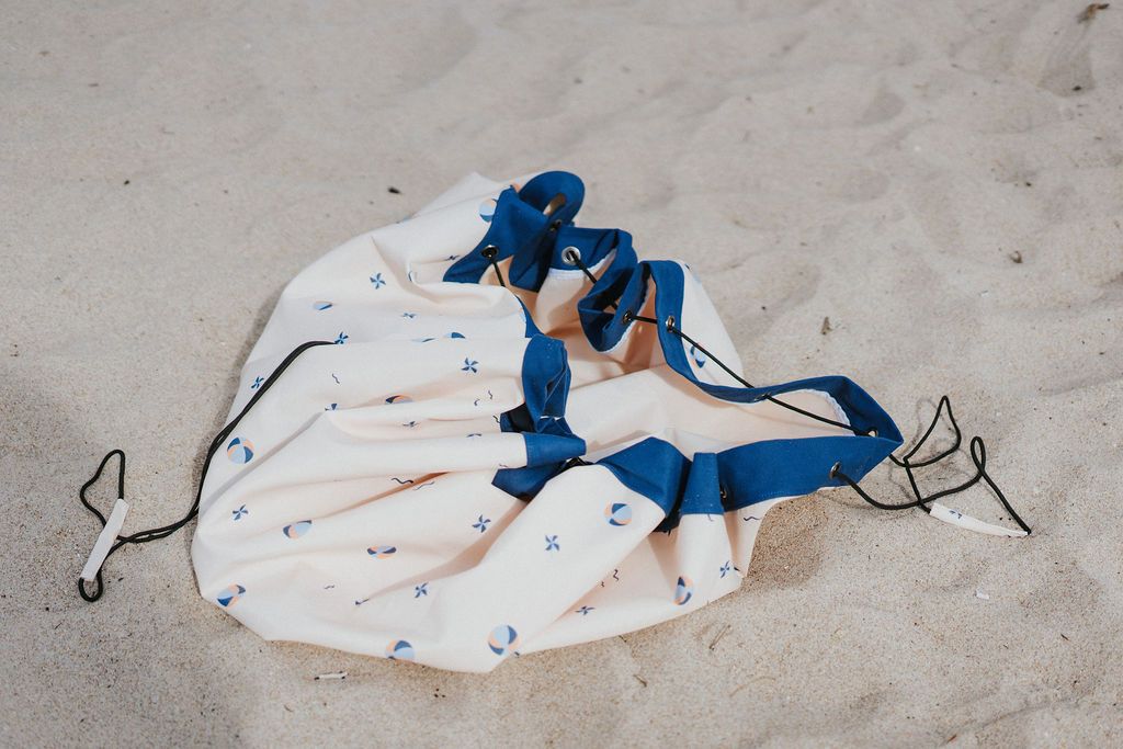 outdoor balloon storage bag and play mat, bag lying in the sand