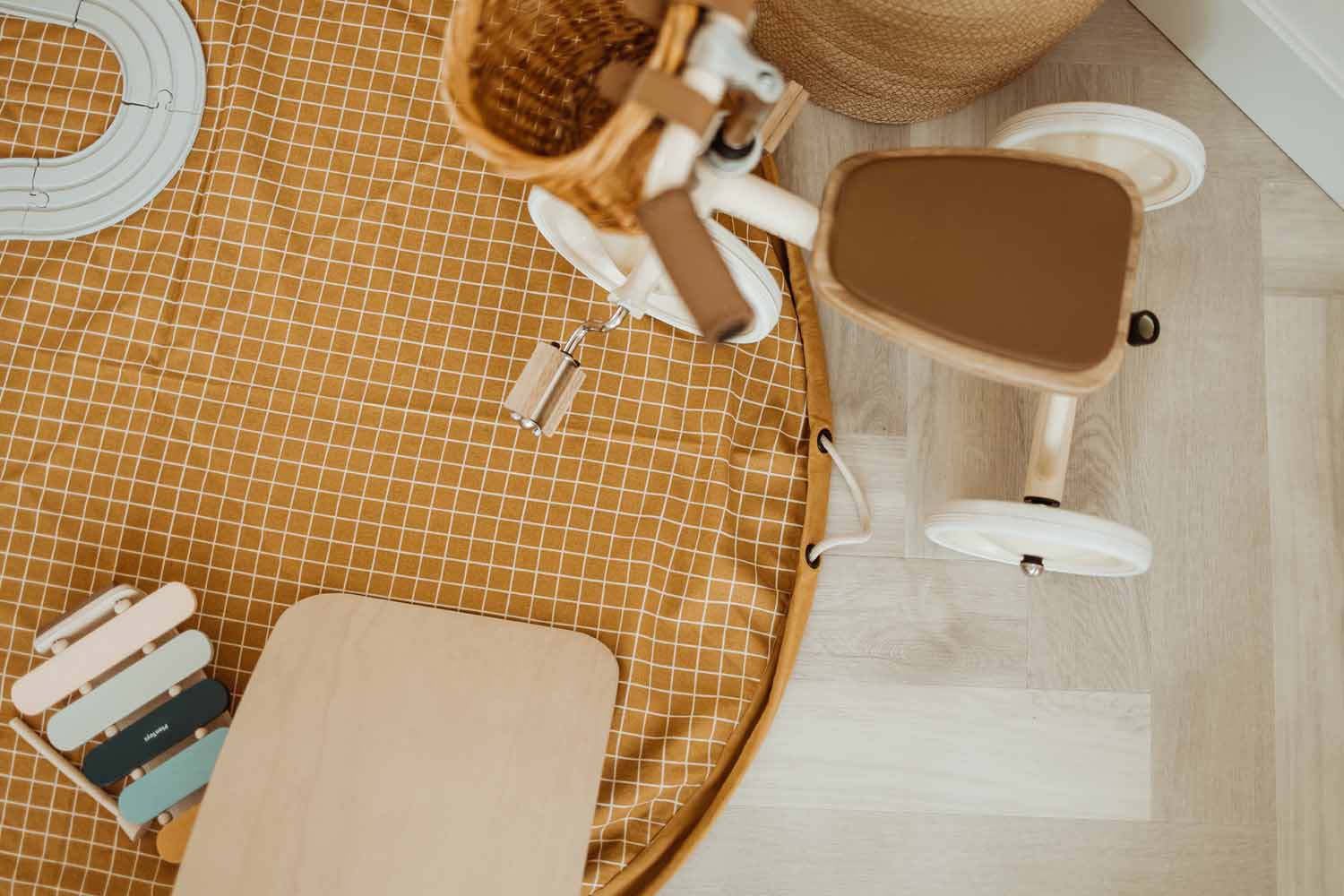 open organic grid mustard storage bag, on floor, tricycle