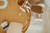 open organic grid mustard storage bag, on floor, tricycle
