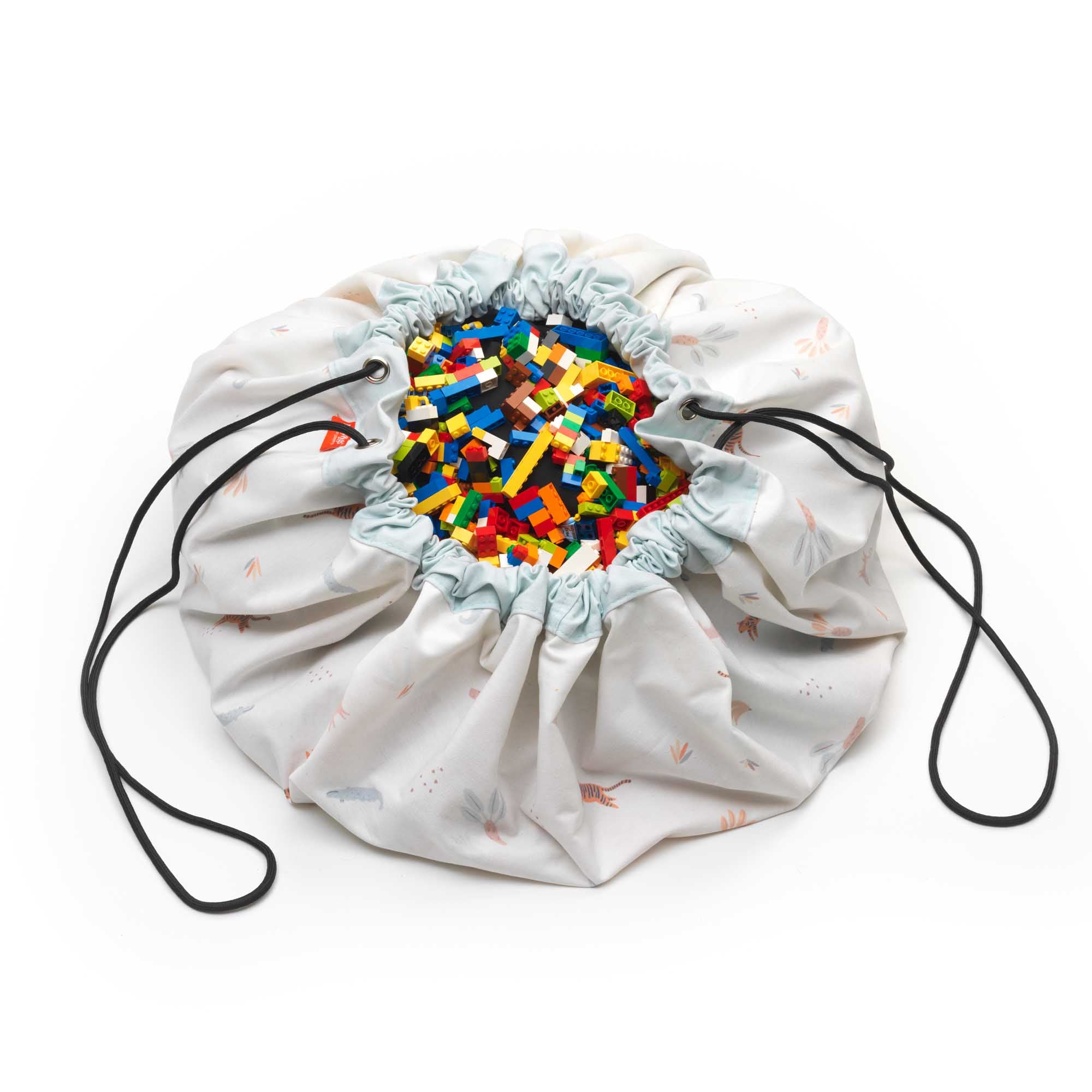 jungle storage bag, detail picture of closed bag, filled with lego